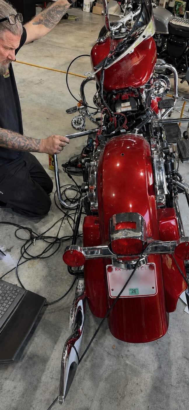 Sean diagnosing a motorcycle